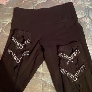 Calvin Klein size small black leggings with crisscross Calvin Klein symb…